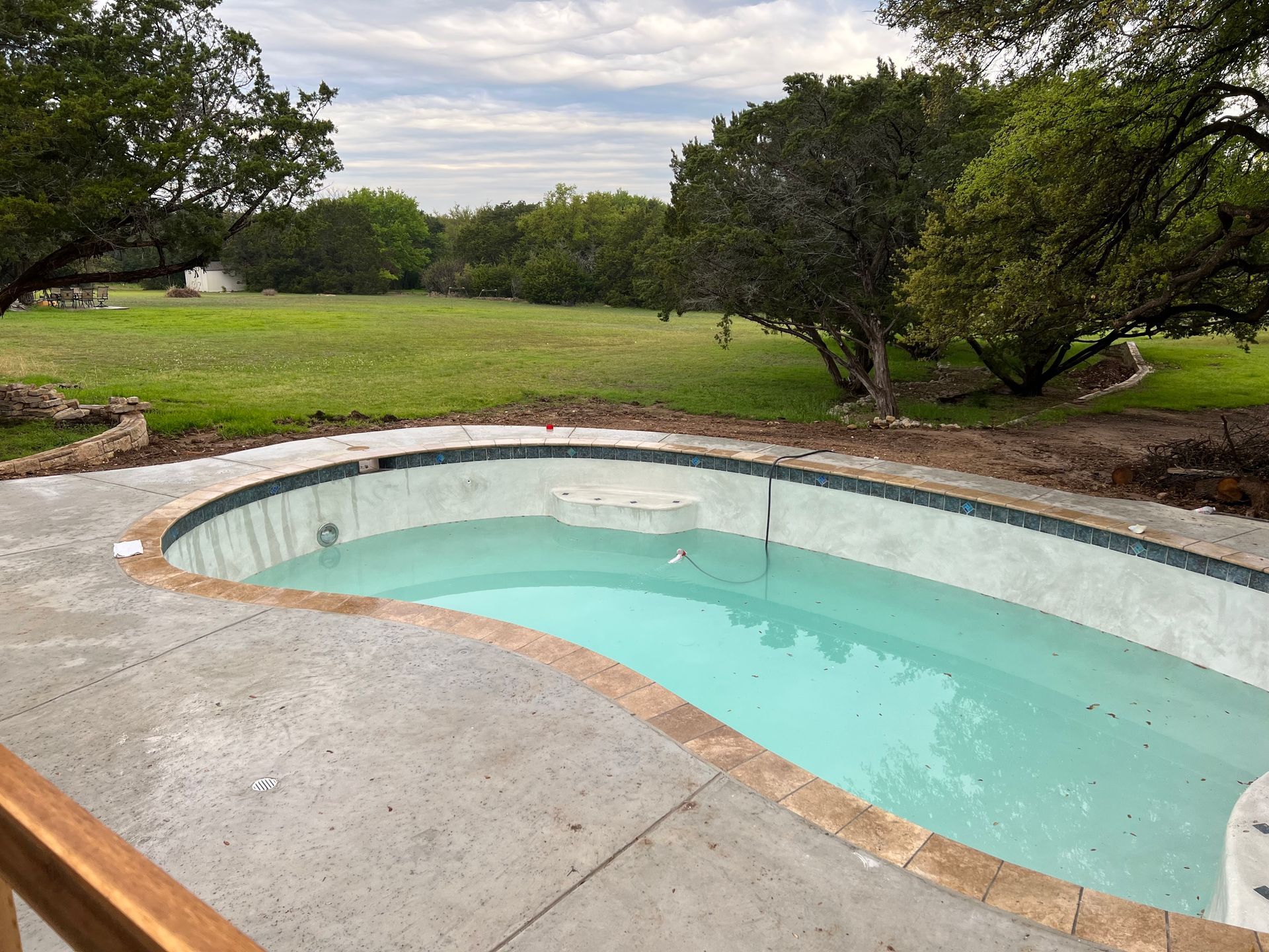 Custom gunite pool finished by GoodTimes Gunite Pools — Godley, Johnson County, TX.