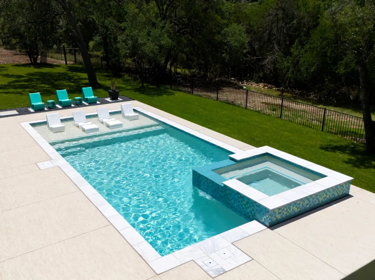 Freeform gunite pool with water feature in Godley, TX